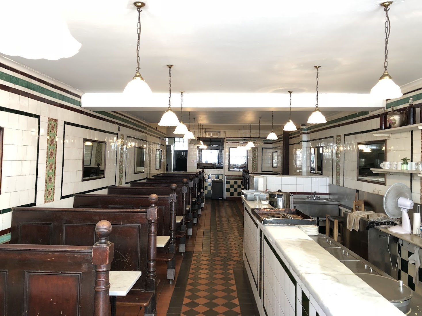 The Grade II tiled Victorian dining room at M. Manze